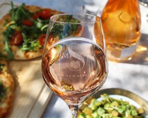 Simpsons wine - Ralway Hill Rose glass half ful on table with salad and lunch foods